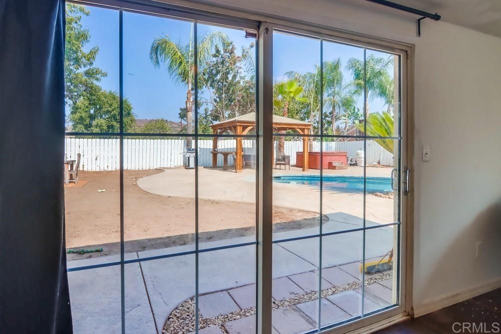 9201 Shadow Hill Road Santee, CA 92071 - Photo 23 of 30 a bathroom with a glass shower door