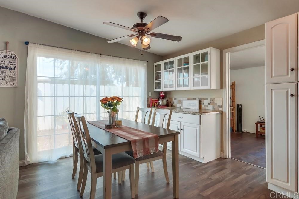 9201 Shadow Hill Road Santee, CA 92071 - Photo 6 of 30 a view of a dining room with furniture window and wooden floor