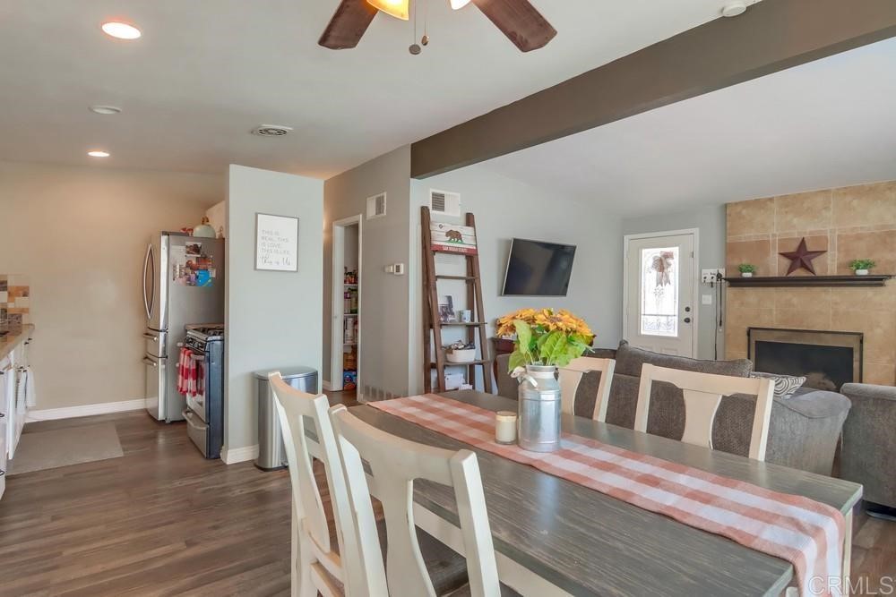9201 Shadow Hill Road Santee, CA 92071 - Photo 9 of 30 a view of a dining room with furniture and wooden floor