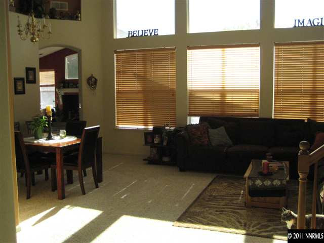 9934 Rio Bravo Drive Reno, NV 89521 - Photo 1 of 1 a living room with furniture and a flat screen tv