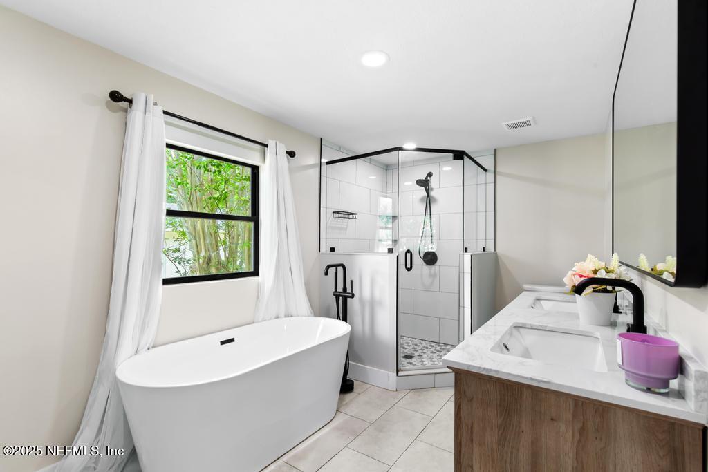 54308 Hurst Road Callahan, FL 32011 - Photo 30 of 49 a bathroom with a sink and a bathtub