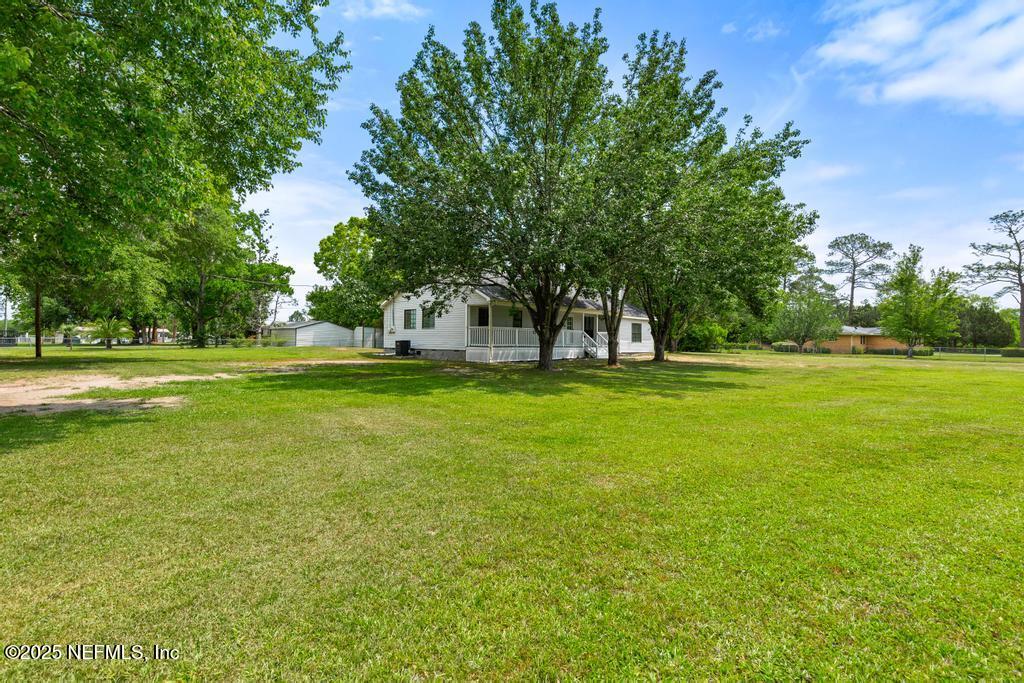54308 Hurst Road Callahan, FL 32011 - Photo 3 of 49 a view of the ground with large trees