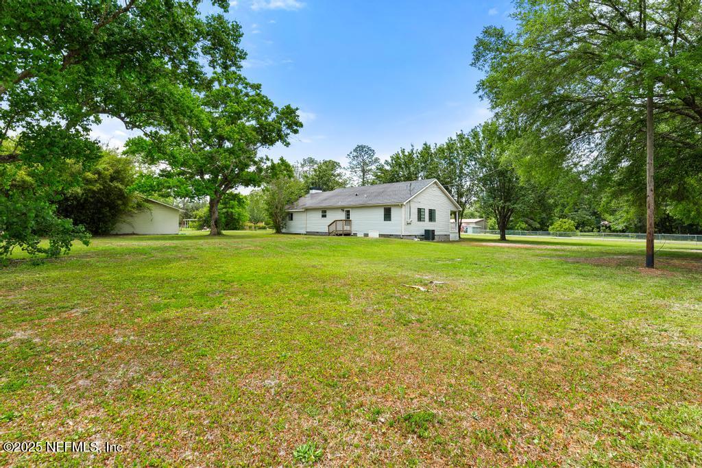 54308 Hurst Road Callahan, FL 32011 - Photo 43 of 49 a view of a big yard with a house
