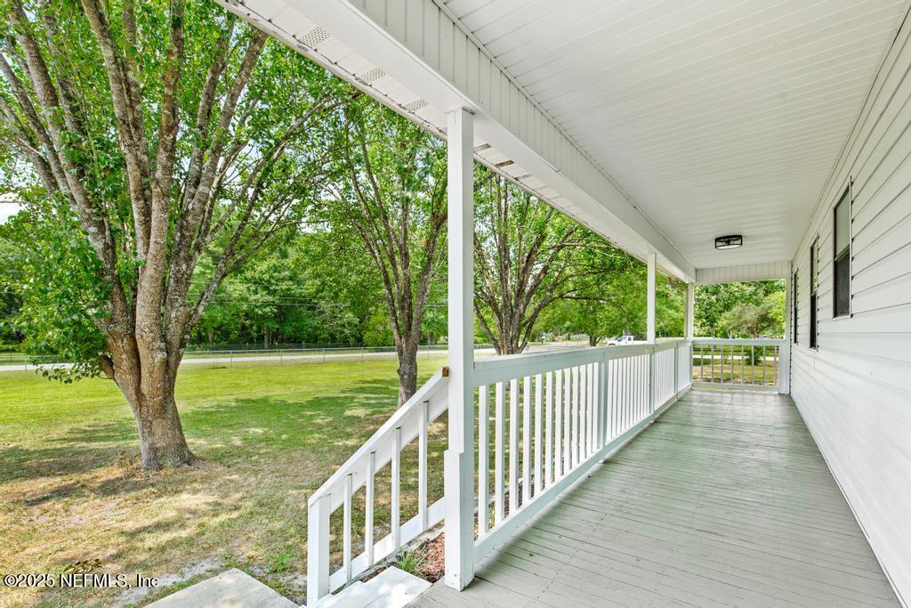 54308 Hurst Road Callahan, FL 32011 - Photo 5 of 49 a view of a porch and garden