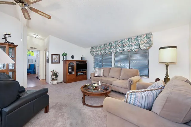 a kitchen with stainless steel appliances granite countertop a sink and a stove