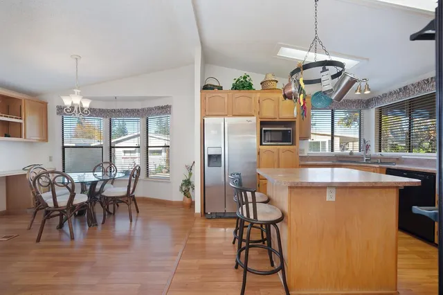 a bedroom with a bed and a mirror