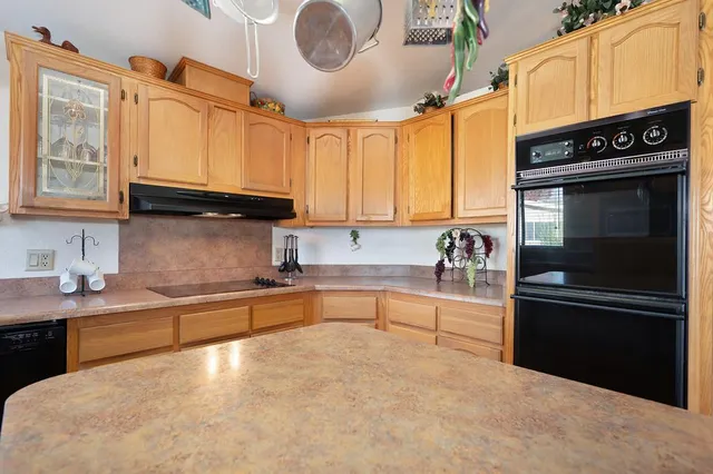 a bedroom with a large bed and flat screen tv