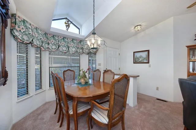 a kitchen with stainless steel appliances a refrigerator a stove a sink dishwasher and cabinets with wooden floor