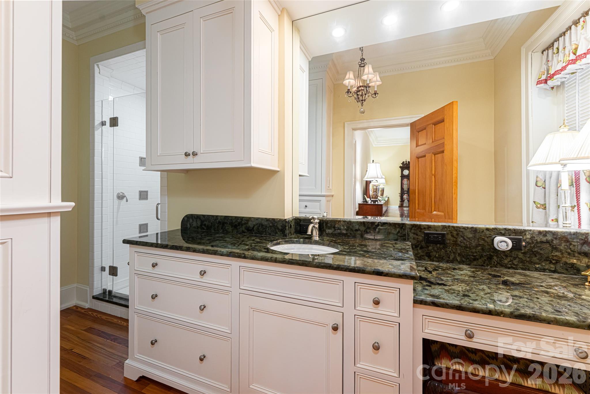 324 Vanderbilt Road Asheville, NC 28803 - Photo 27 of 48 a bathroom with a granite countertop sink and a mirror