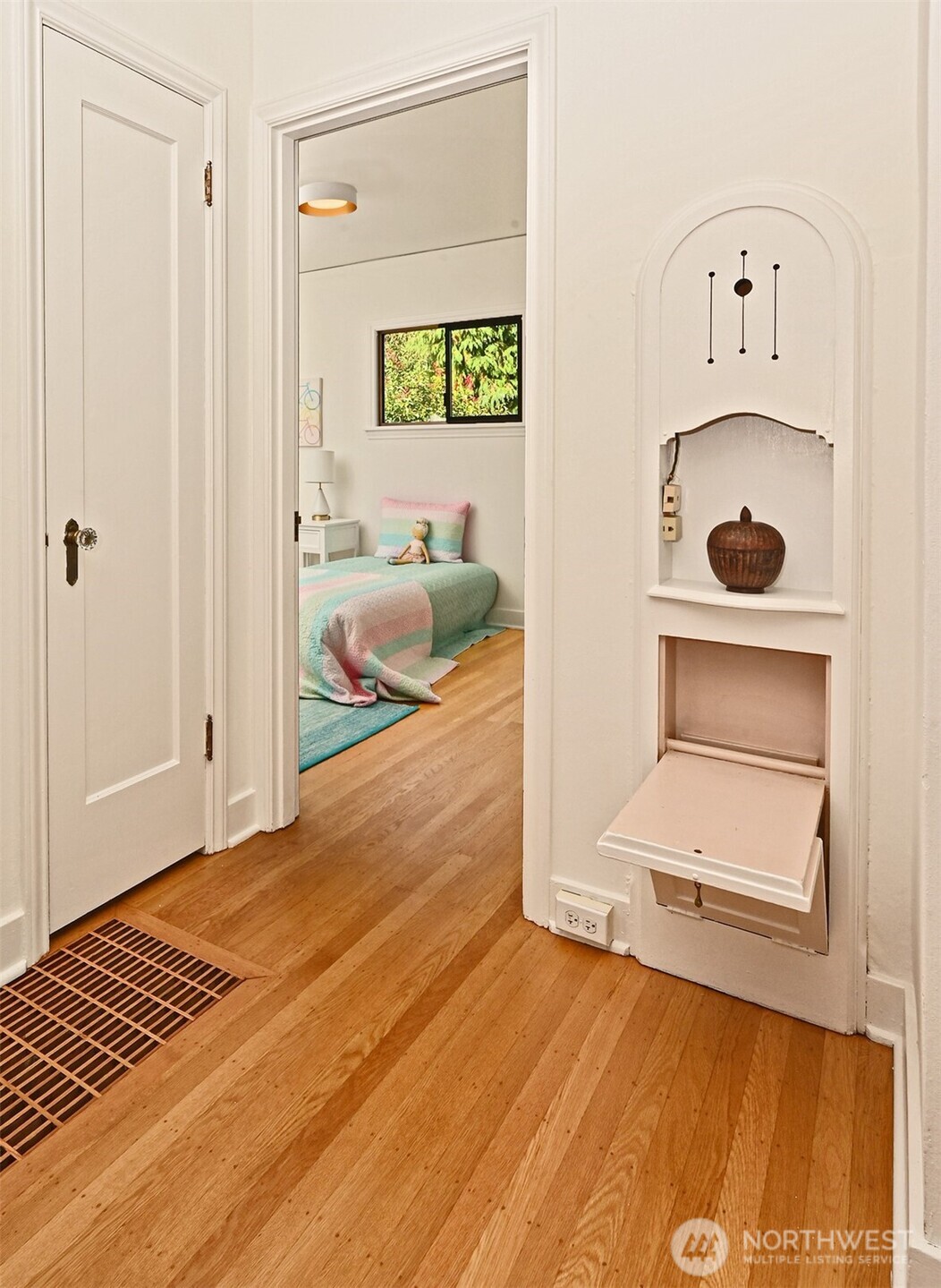 334 Northeast 57th Street Seattle, WA 98105 - Photo 20 of 39 a bedroom with a bed and a view of kitchen