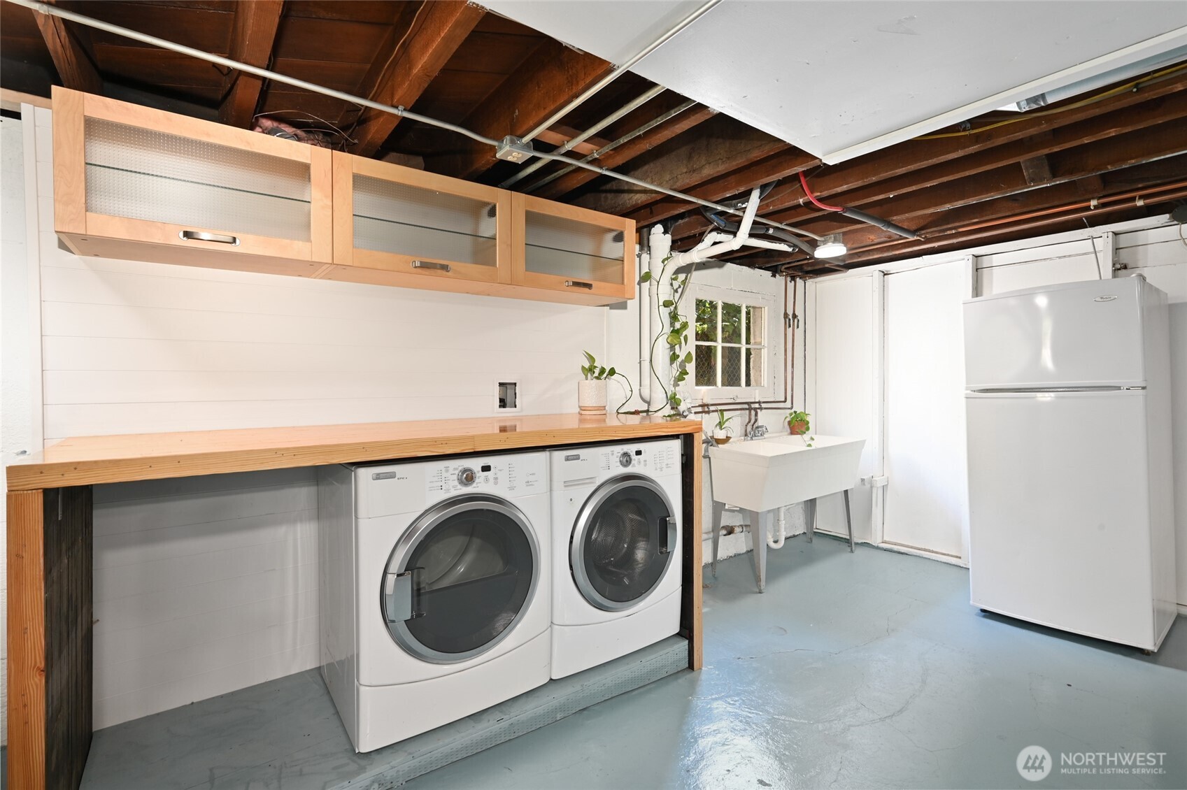 334 Northeast 57th Street Seattle, WA 98105 - Photo 26 of 39 a utility room with dryer and washer