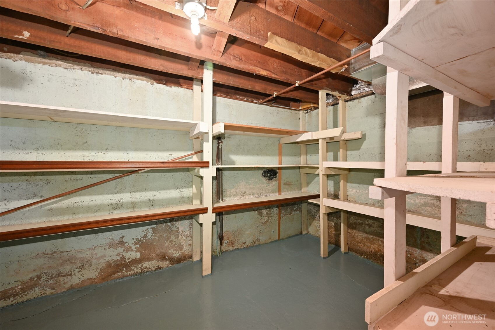 334 Northeast 57th Street Seattle, WA 98105 - Photo 28 of 39 a view of an empty room with wooden floor and a window