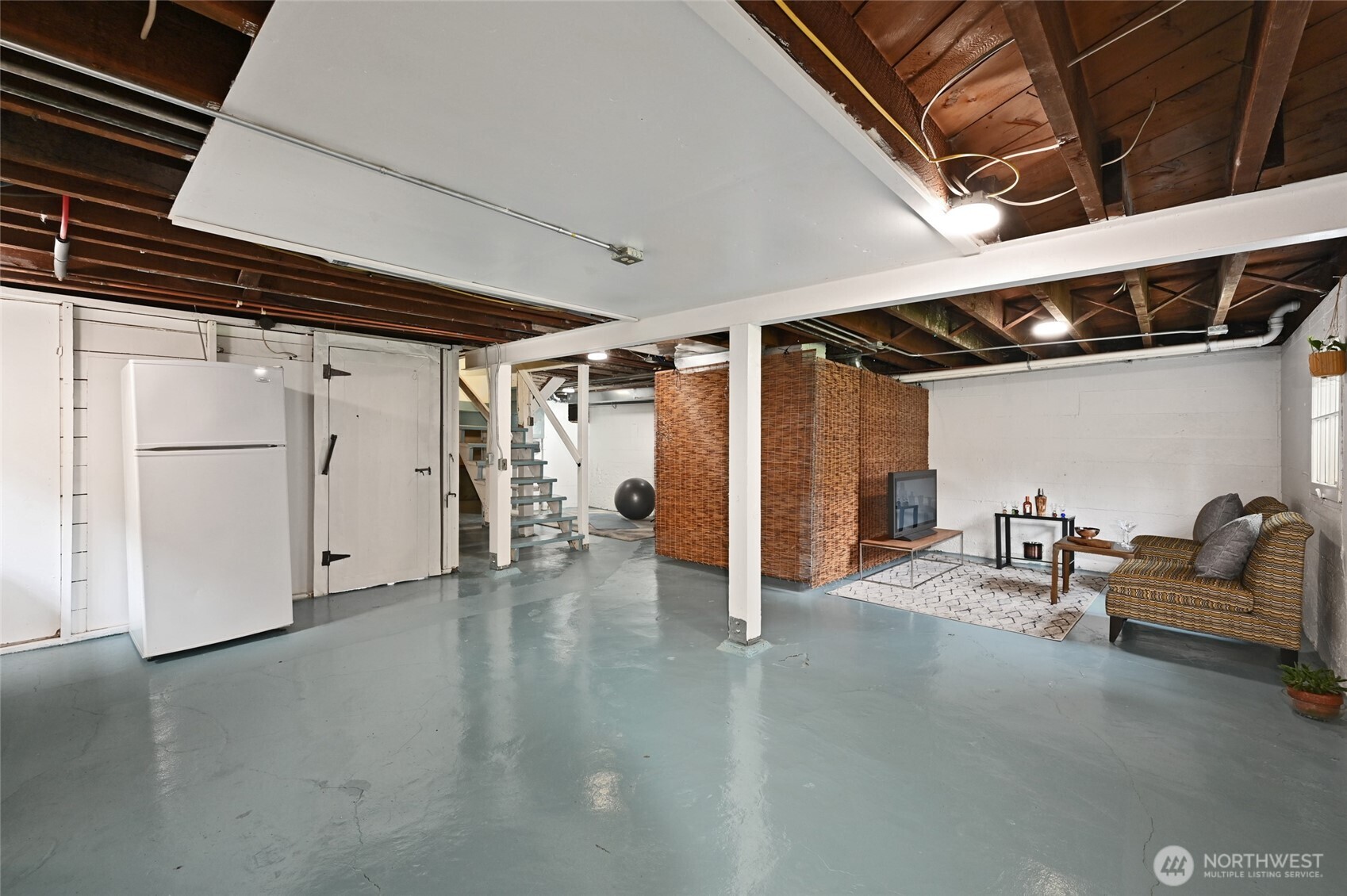 334 Northeast 57th Street Seattle, WA 98105 - Photo 29 of 39 a view of an empty room with air conditioner duct and materials on floor