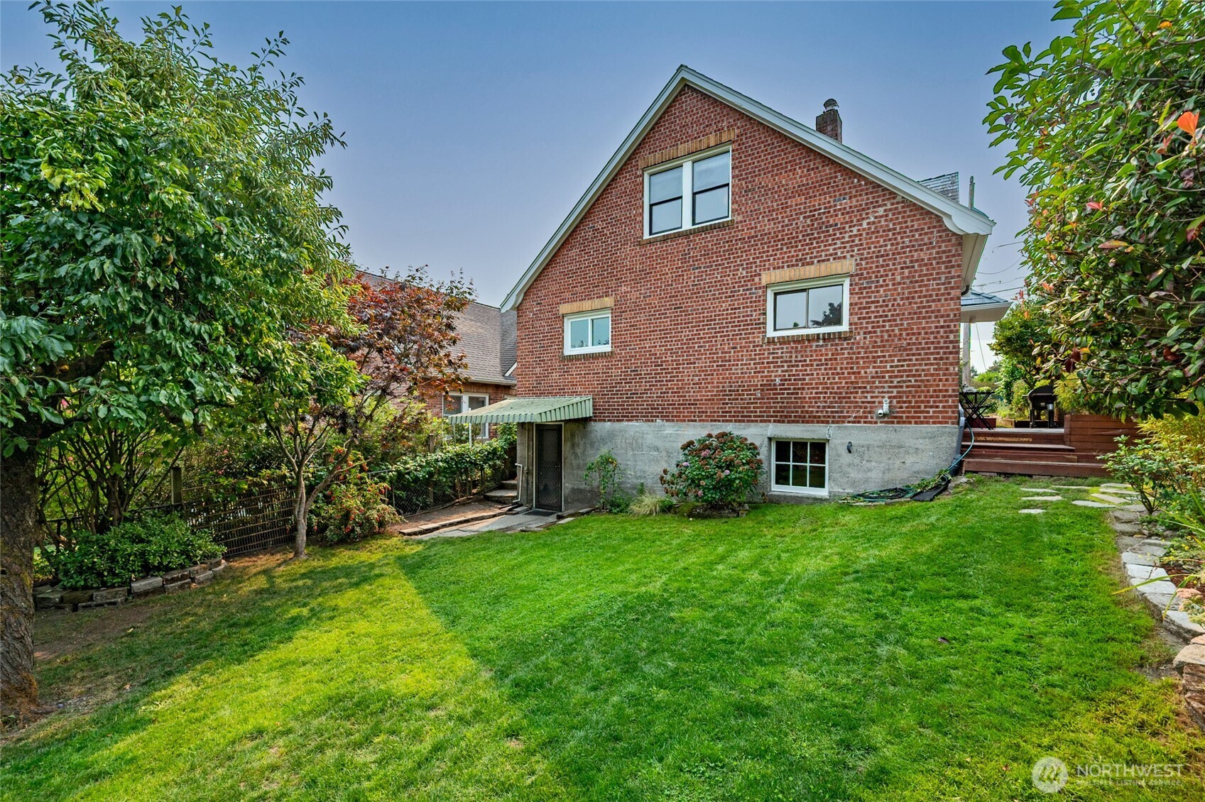 334 Northeast 57th Street Seattle, WA 98105 - Photo 35 of 39 a front view of a house with a yard
