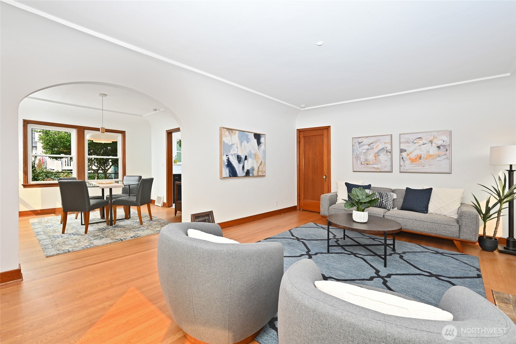 334 Northeast 57th Street Seattle, WA 98105 - Photo 10 of 39 a living room with furniture and a wooden floor