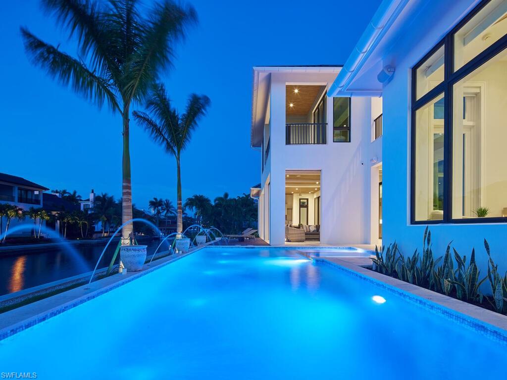 575 17th Avenue South Naples, FL 34102 - Photo 37 of 41 View of swimming pool featuring pool water feature