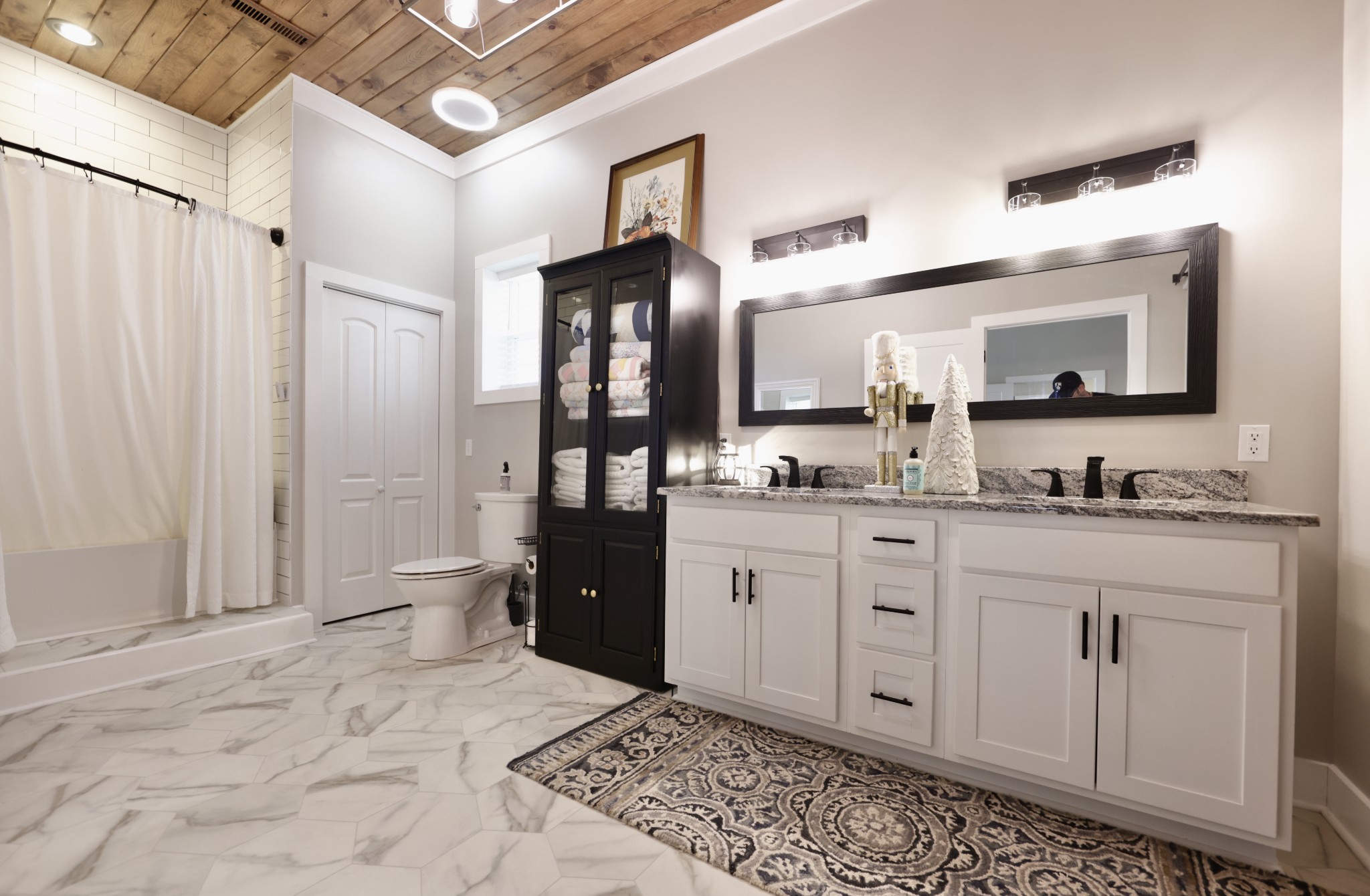 191 Doug Williams Road Portland, TN 37148 - Photo 13 of 51 a spacious bathroom with a granite countertop sink and a mirror