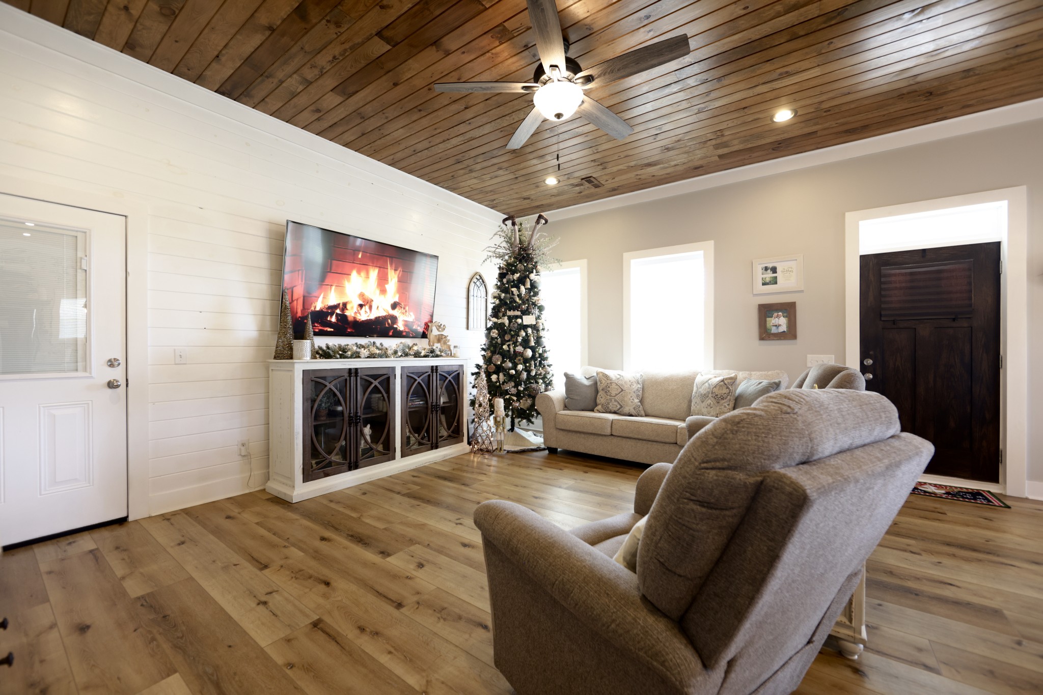 191 Doug Williams Road Portland, TN 37148 - Photo 7 of 51 a living room with furniture a flat screen tv and a fireplace