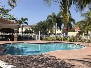a view of a swimming pool with a patio