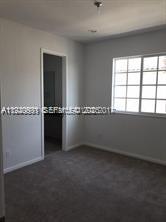 2675 Southwest 81st Terrace, Unit 2641 Miramar, FL 33025 - Photo 8 of 18 an empty room with windows