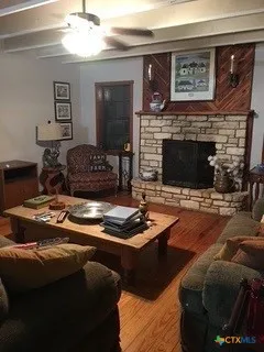 a living room with furniture and a fireplace