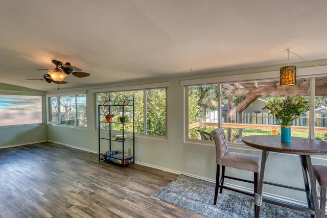a view of a dining room with furniture window and wooden floor