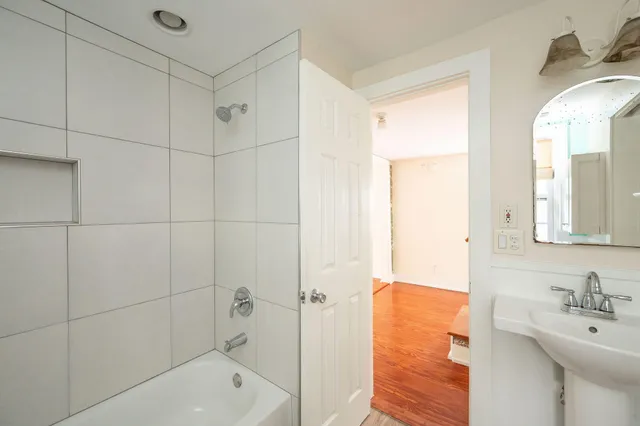 a bathroom with a bathtub and a sink