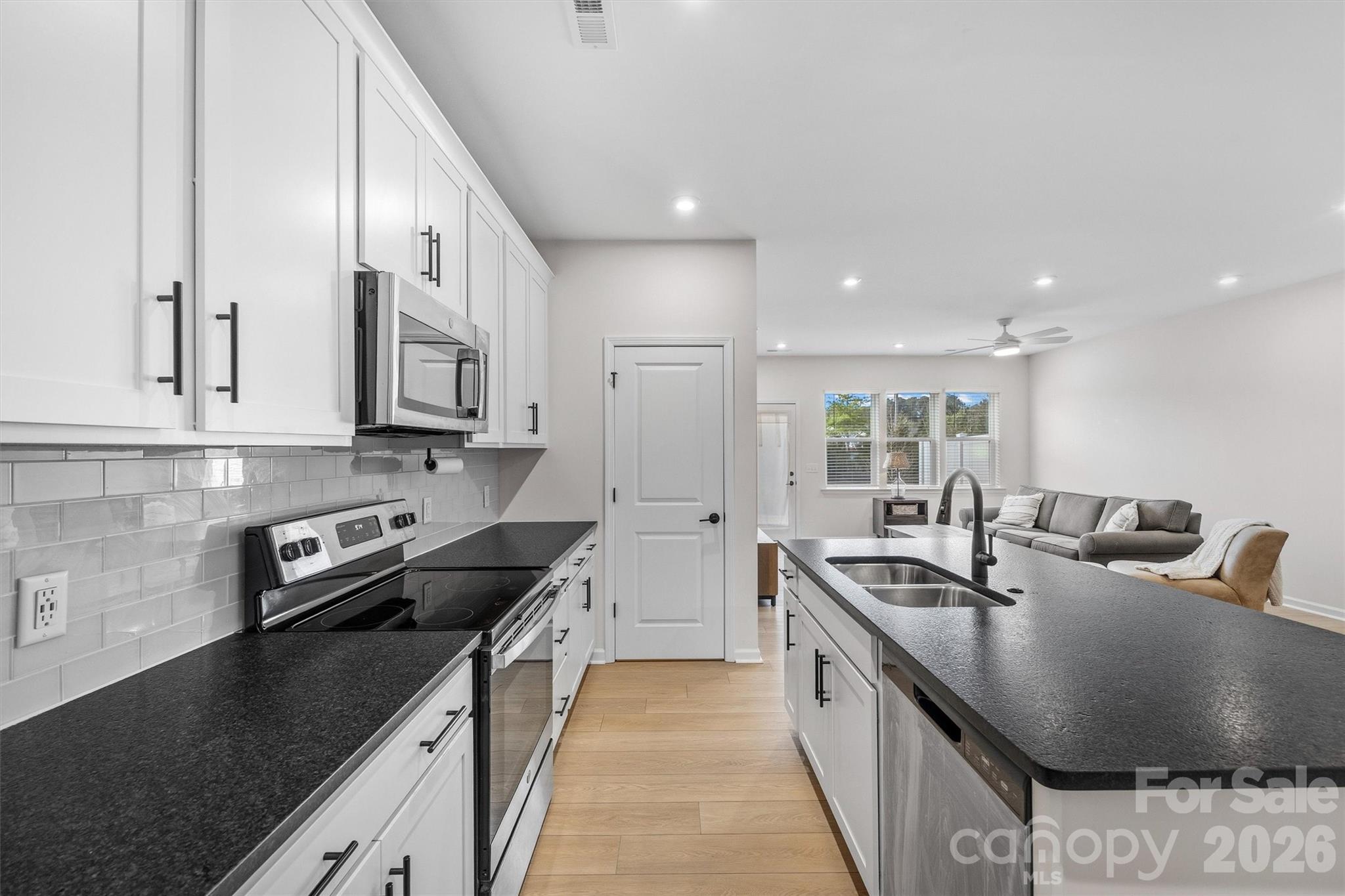 217 Brooks Springs Drive Fort Mill, SC 29708 - Photo 11 of 36 a kitchen with stainless steel appliances granite countertop a sink a stove and a refrigerator