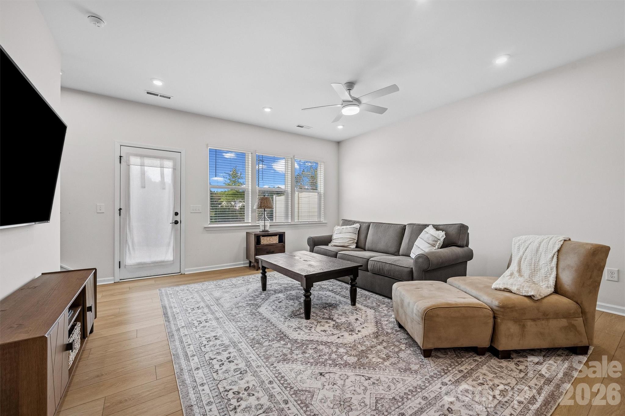 217 Brooks Springs Drive Fort Mill, SC 29708 - Photo 14 of 36 a living room with furniture and a flat screen tv