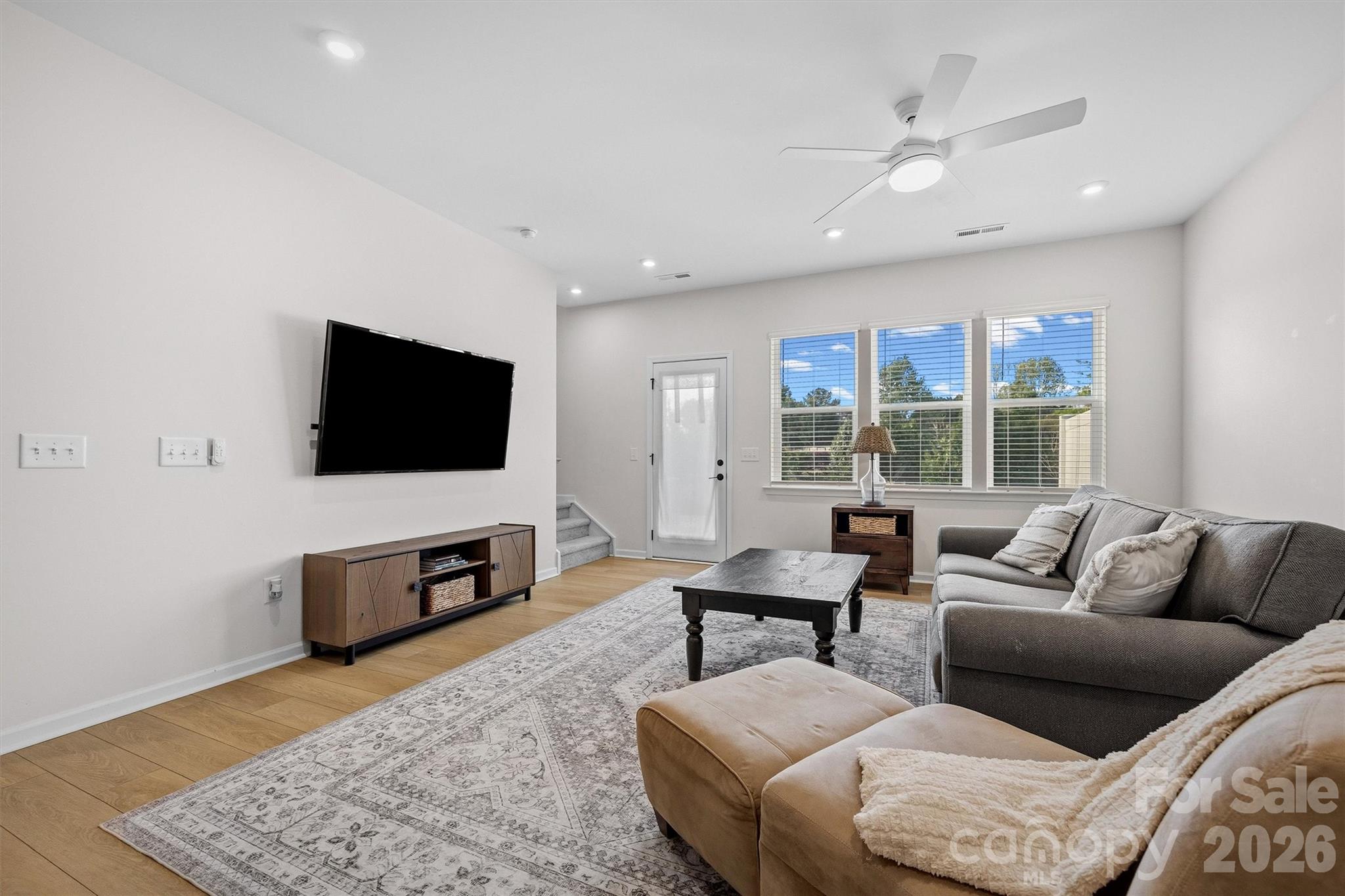 217 Brooks Springs Drive Fort Mill, SC 29708 - Photo 15 of 36 a living room with furniture and a flat screen tv