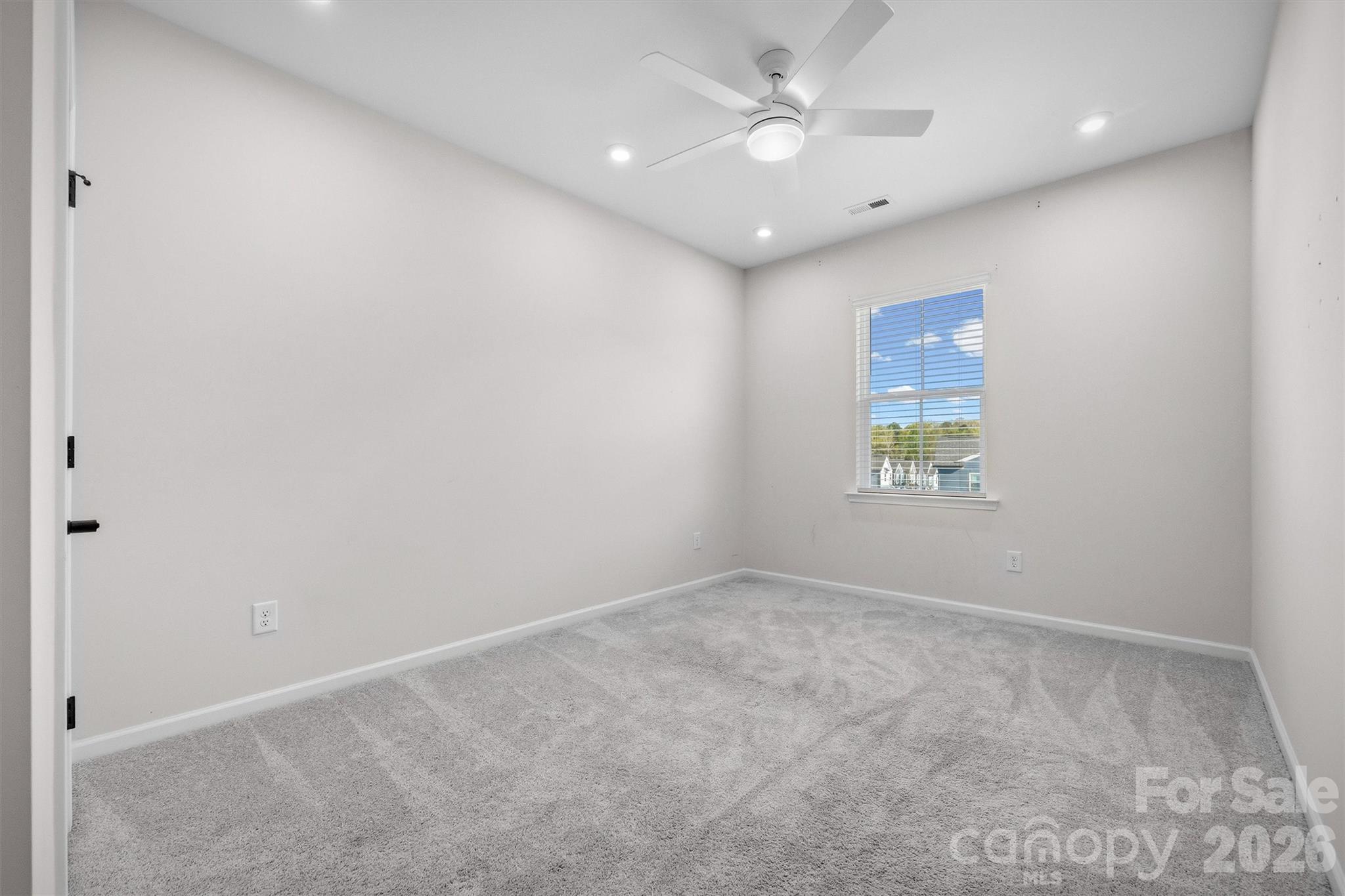 217 Brooks Springs Drive Fort Mill, SC 29708 - Photo 26 of 36 an empty room with a window and a fan