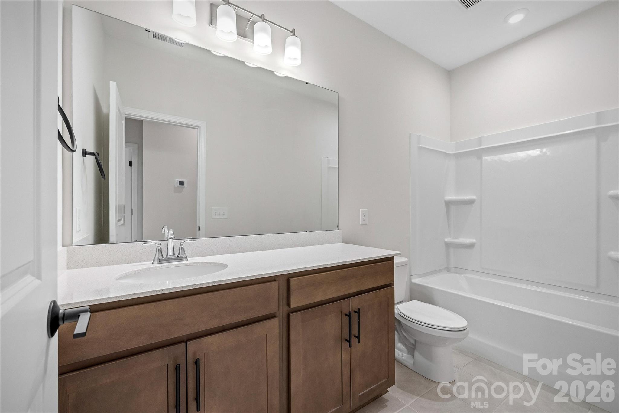 217 Brooks Springs Drive Fort Mill, SC 29708 - Photo 30 of 36 a bathroom with a sink a toilet and shower
