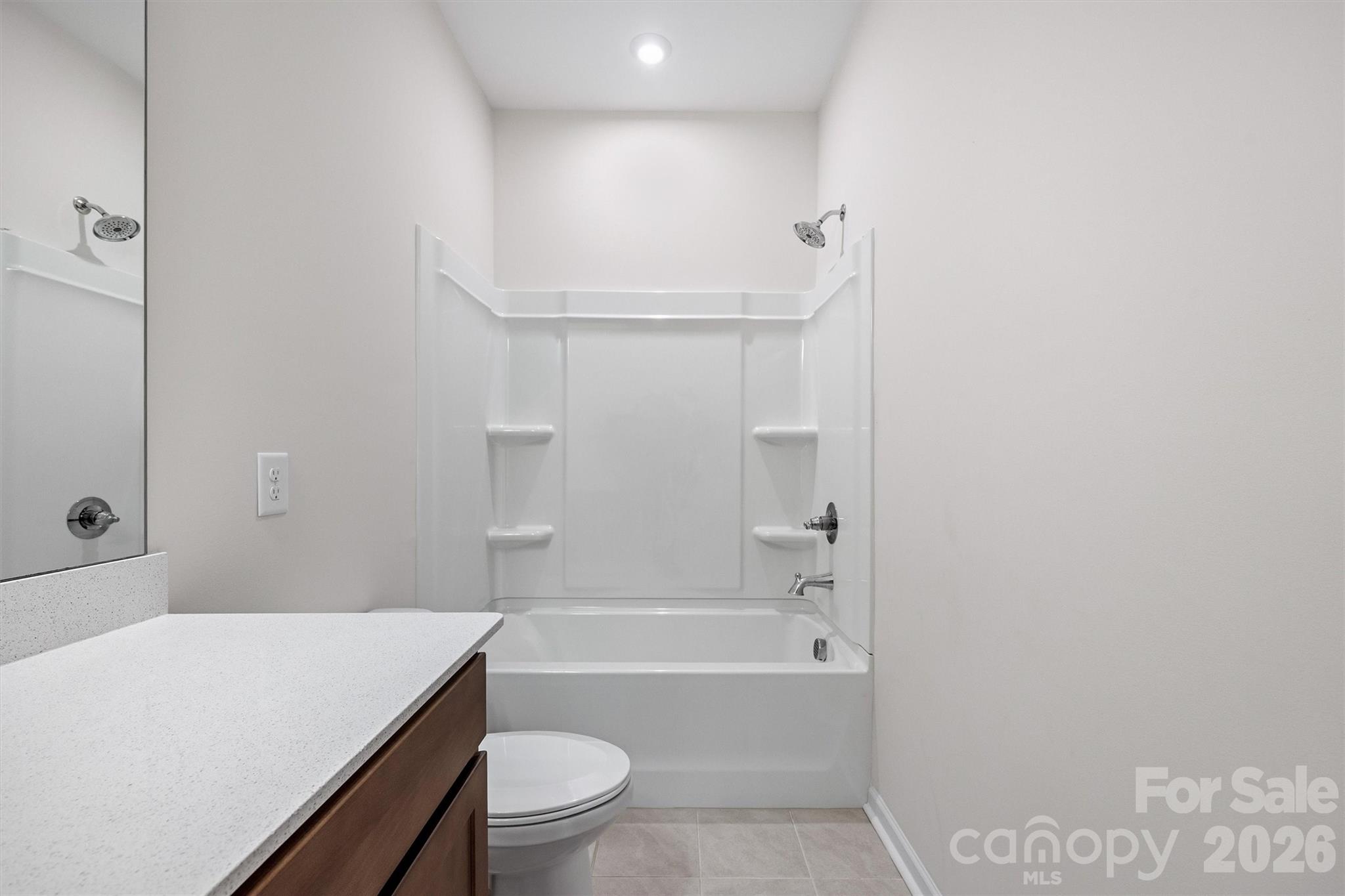 217 Brooks Springs Drive Fort Mill, SC 29708 - Photo 31 of 36 a bathroom with a sink toilet vanity and bathtub