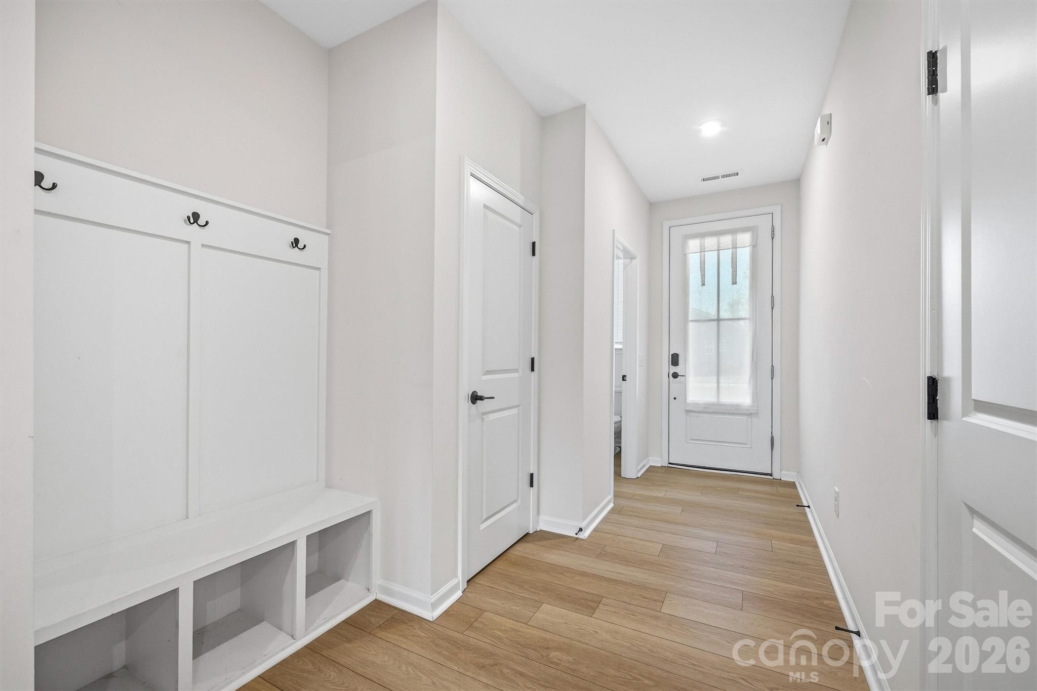 217 Brooks Springs Drive Fort Mill, SC 29708 - Photo 4 of 36 a view of a hallway with wooden floor