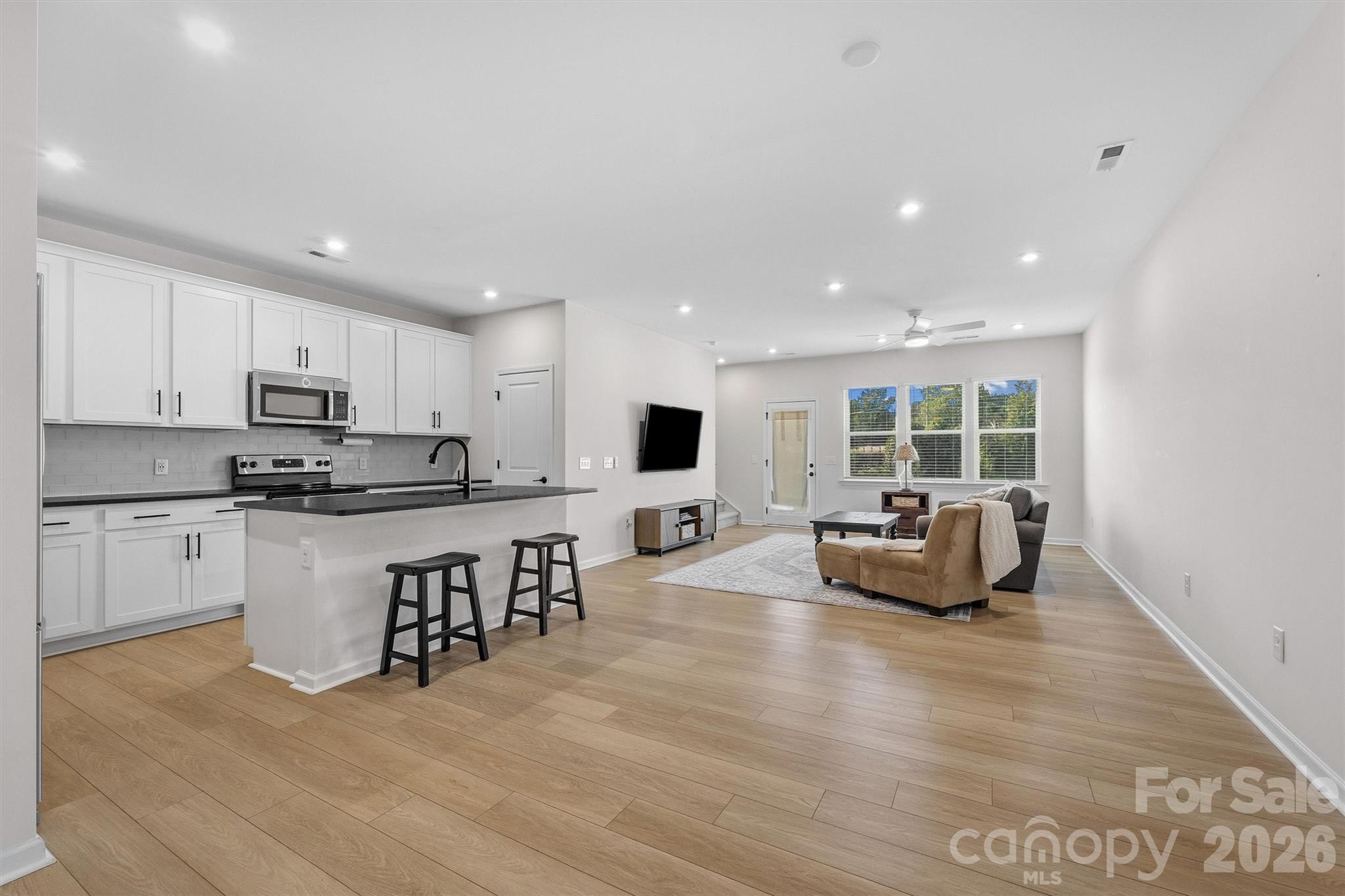 217 Brooks Springs Drive Fort Mill, SC 29708 - Photo 7 of 36 a kitchen with sink refrigerator and stove