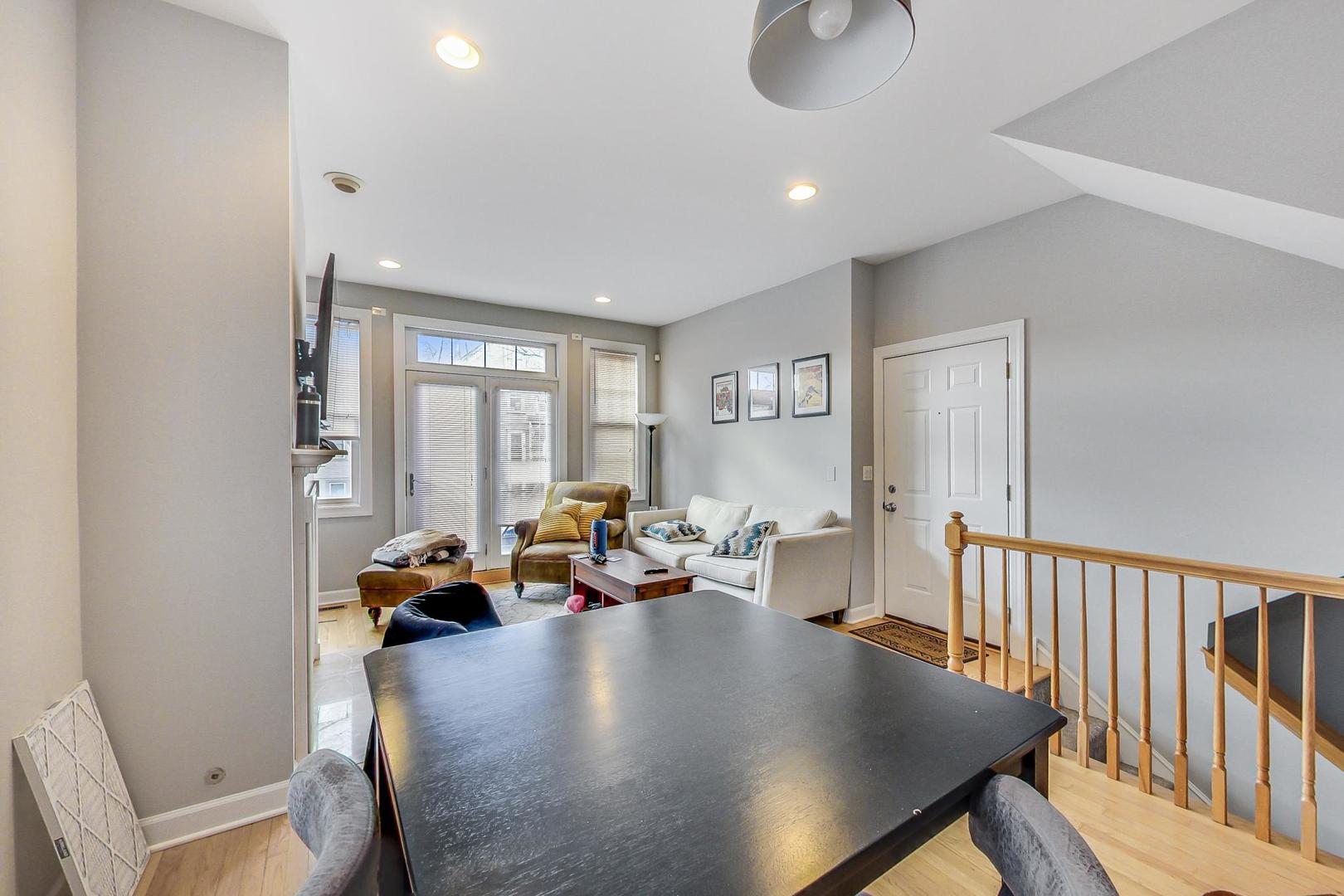 1330 West Fletcher Street, Unit 1 Chicago, IL 60657 - Photo 12 of 42 a living room with furniture and a window