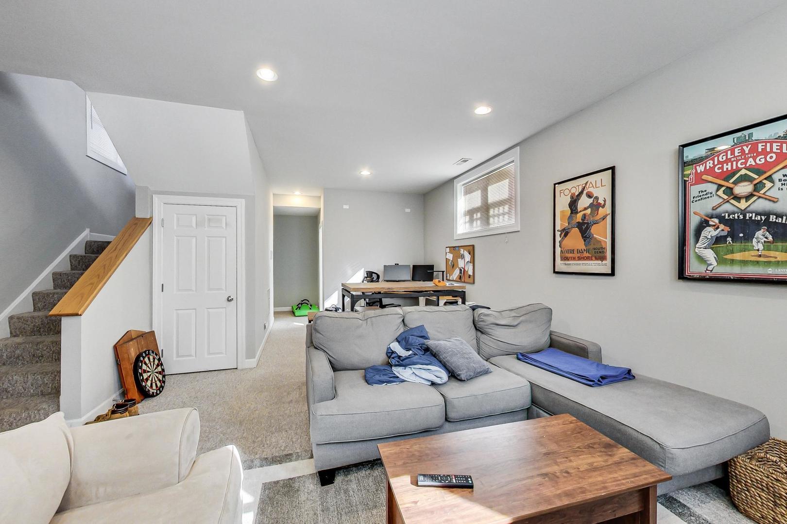 1330 West Fletcher Street, Unit 1 Chicago, IL 60657 - Photo 25 of 42 a living room with furniture and a large window