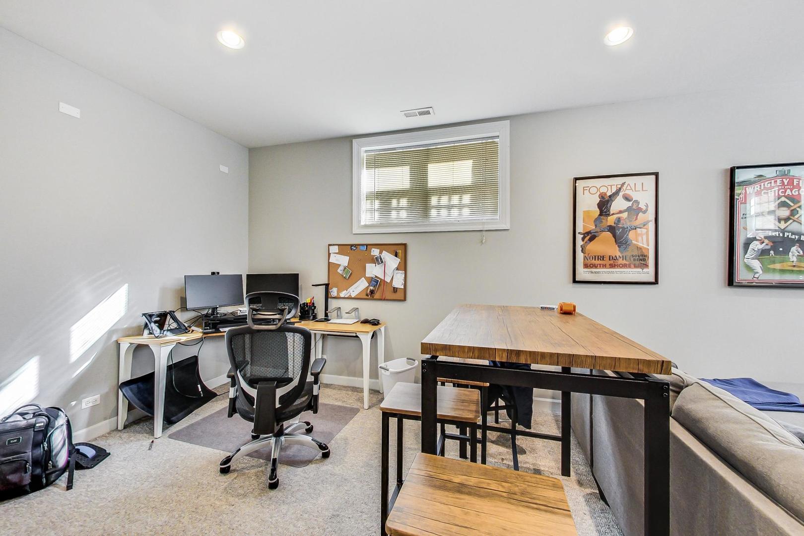 1330 West Fletcher Street, Unit 1 Chicago, IL 60657 - Photo 26 of 42 a view of a workspace with furniture and a window