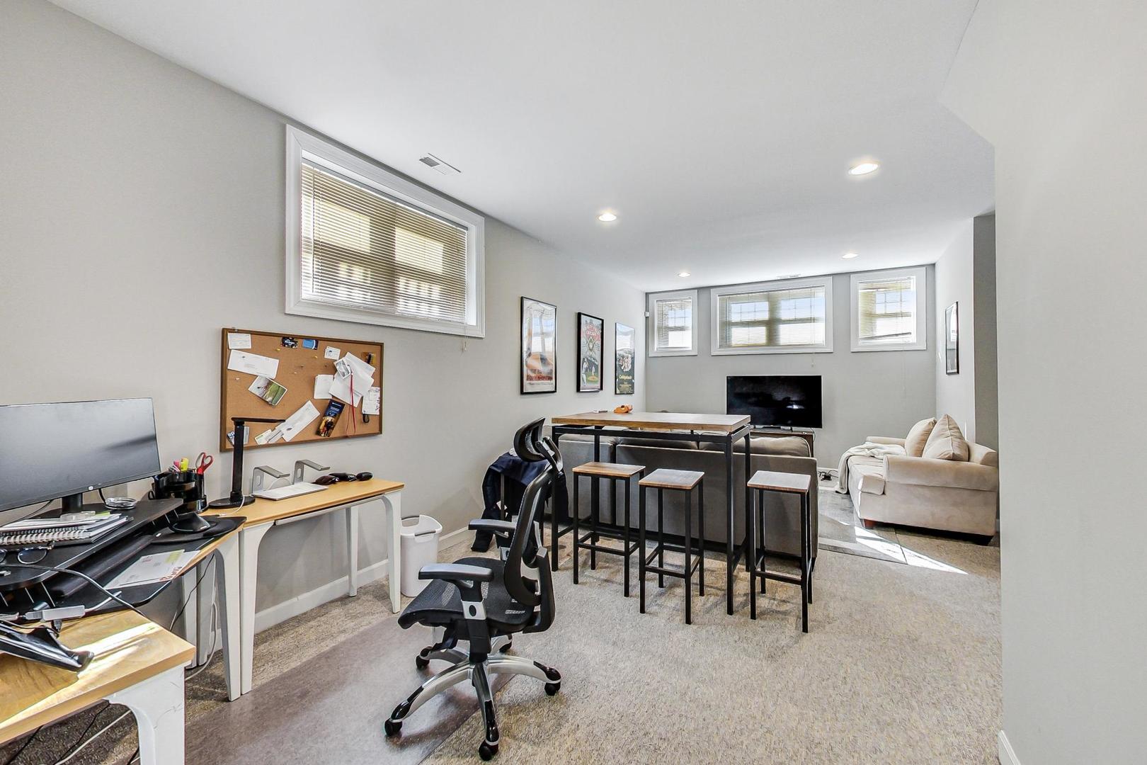 1330 West Fletcher Street, Unit 1 Chicago, IL 60657 - Photo 27 of 42 a view of a workspace with furniture and a livingroom