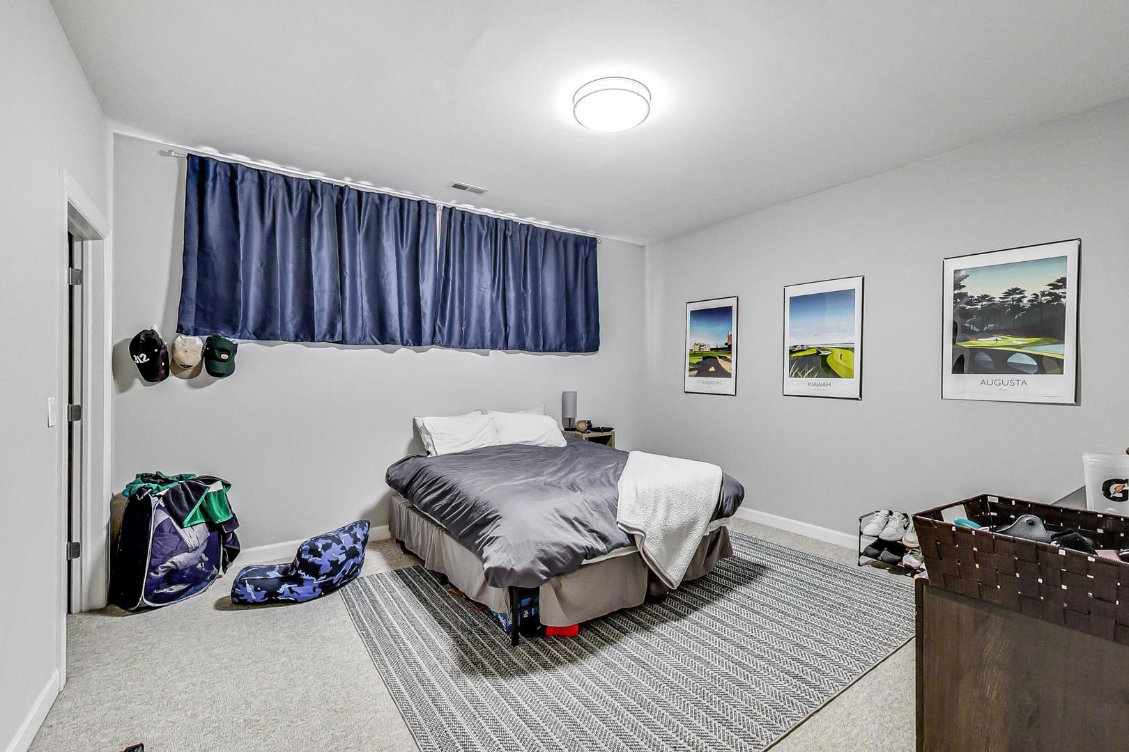 1330 West Fletcher Street, Unit 1 Chicago, IL 60657 - Photo 28 of 42 a living room with a bed furniture and a window