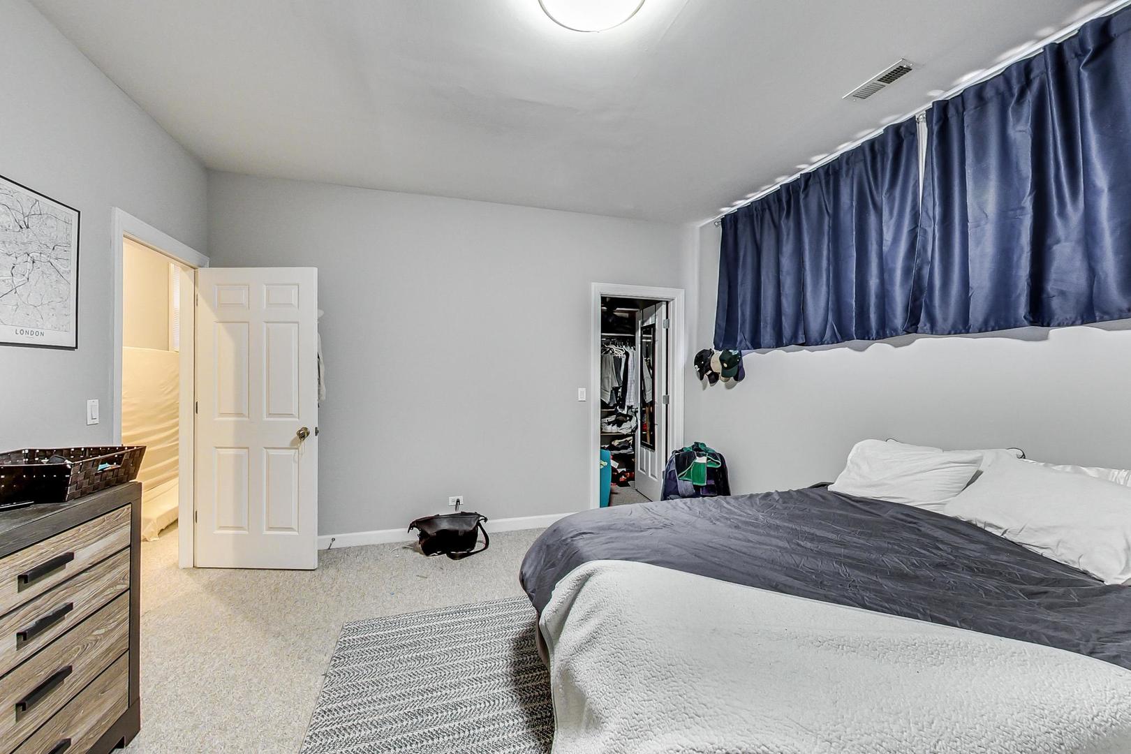 1330 West Fletcher Street, Unit 1 Chicago, IL 60657 - Photo 30 of 42 a bedroom with a bed and a closet