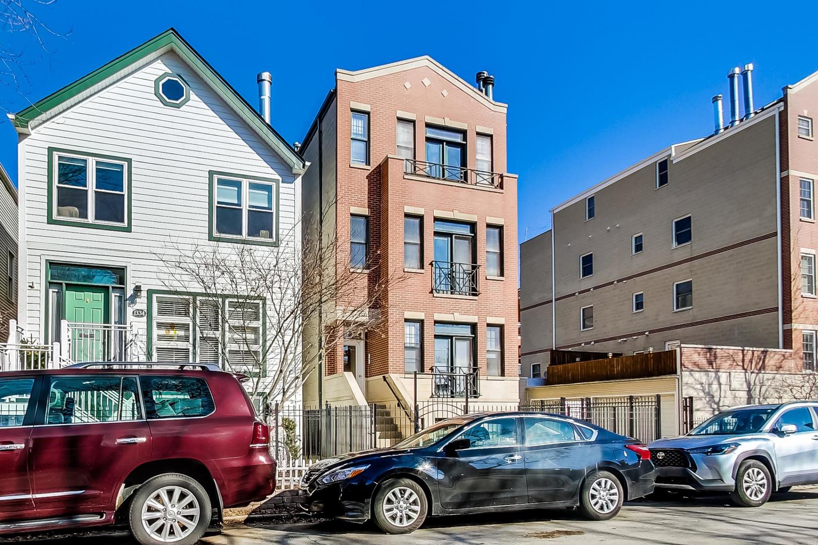 1330 West Fletcher Street, Unit 1 Chicago, IL 60657 - Photo 3 of 42 a car parked in front of a building