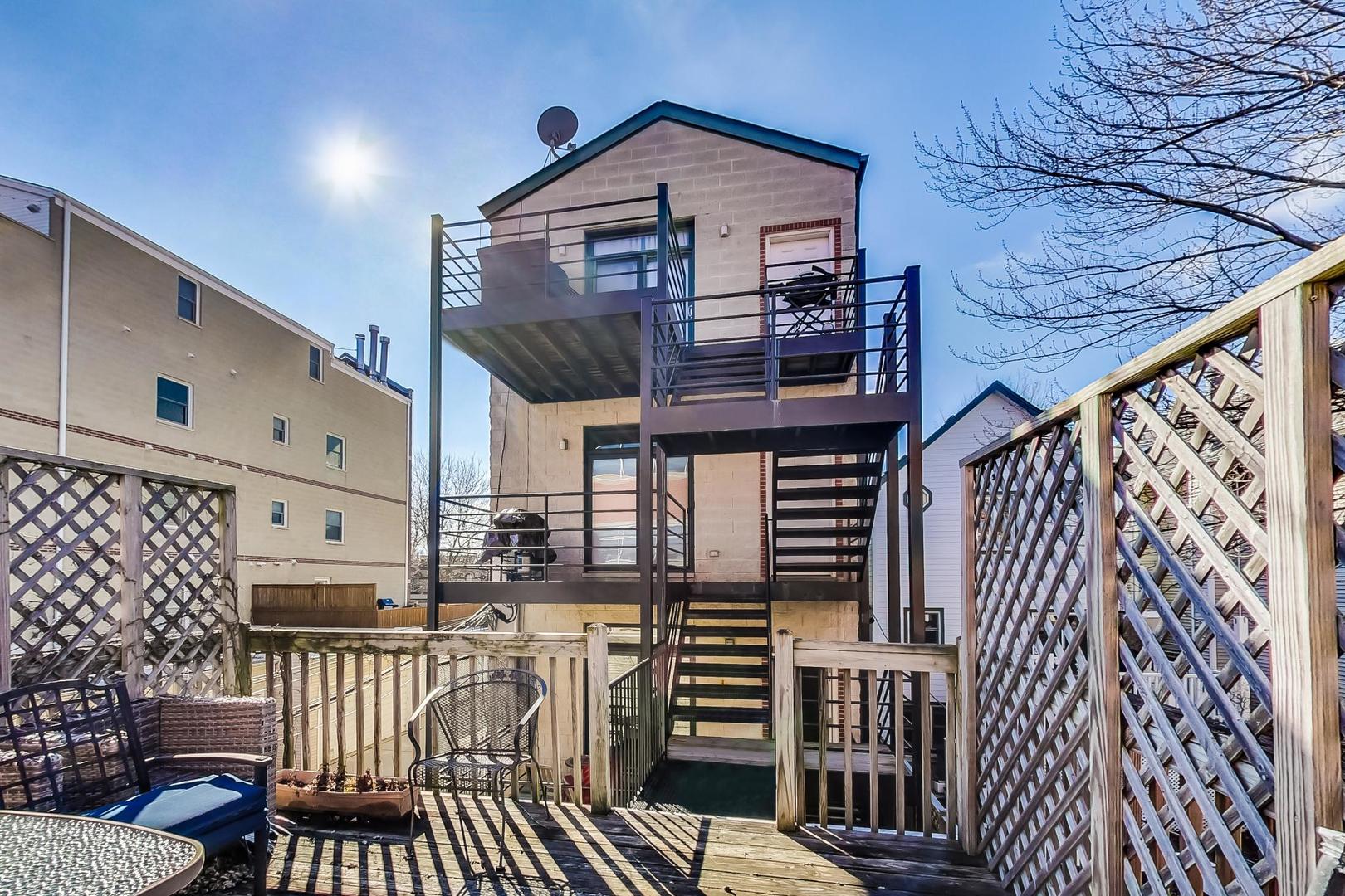 1330 West Fletcher Street, Unit 1 Chicago, IL 60657 - Photo 36 of 42 a front view of a house with balcony