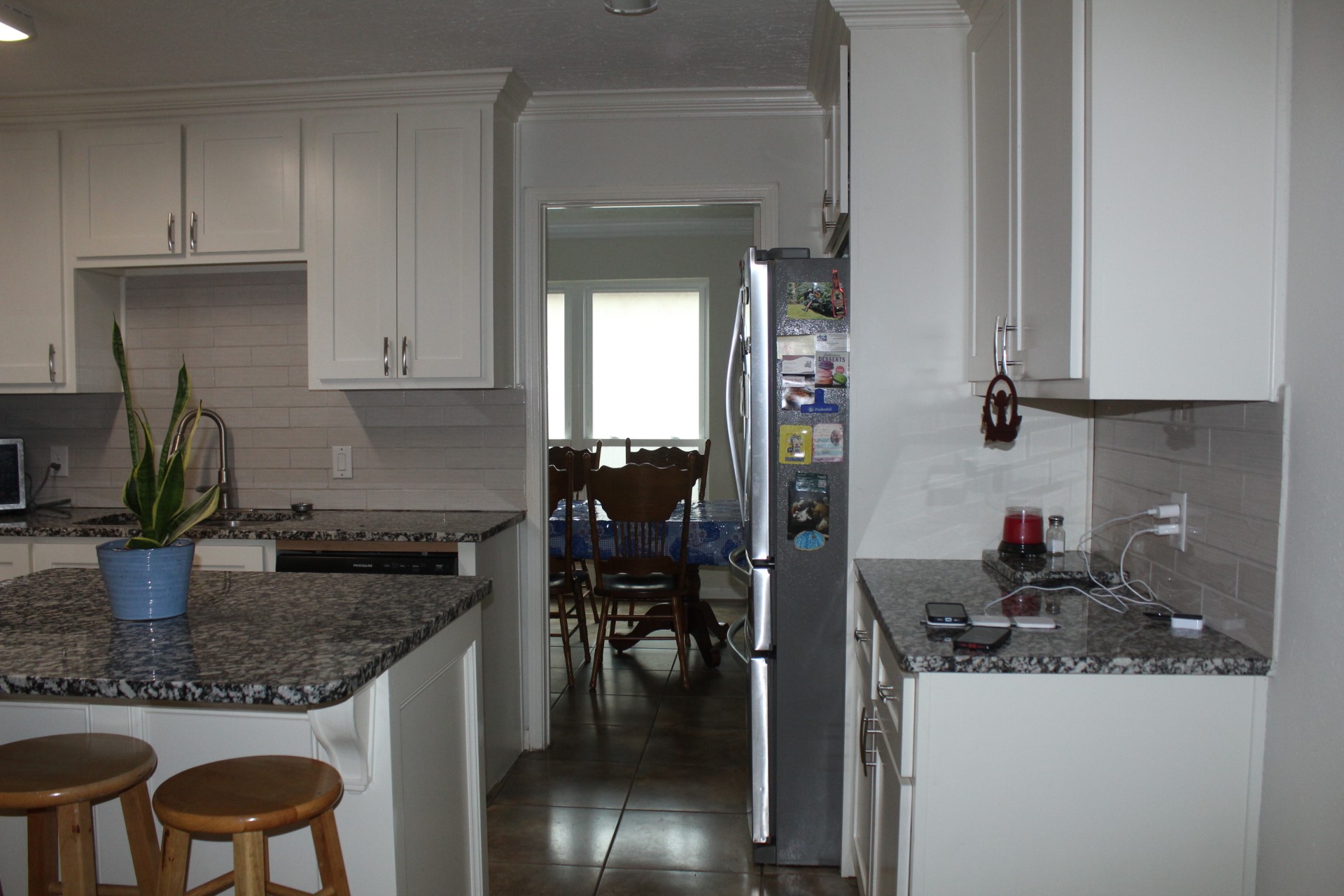11303 Windmark Drive Houston, TX 77099 - Photo 13 of 29 a kitchen with granite countertop a sink and cabinets