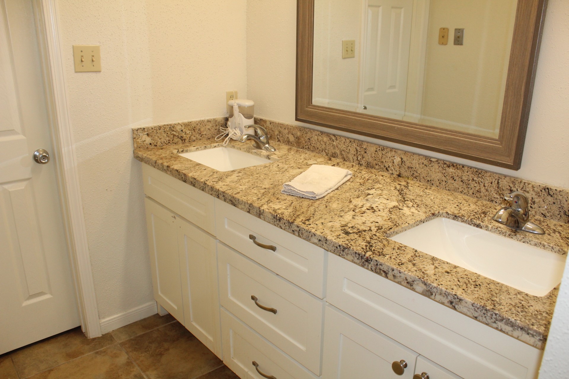 11303 Windmark Drive Houston, TX 77099 - Photo 22 of 29 a bathroom with a granite countertop sink and a mirror