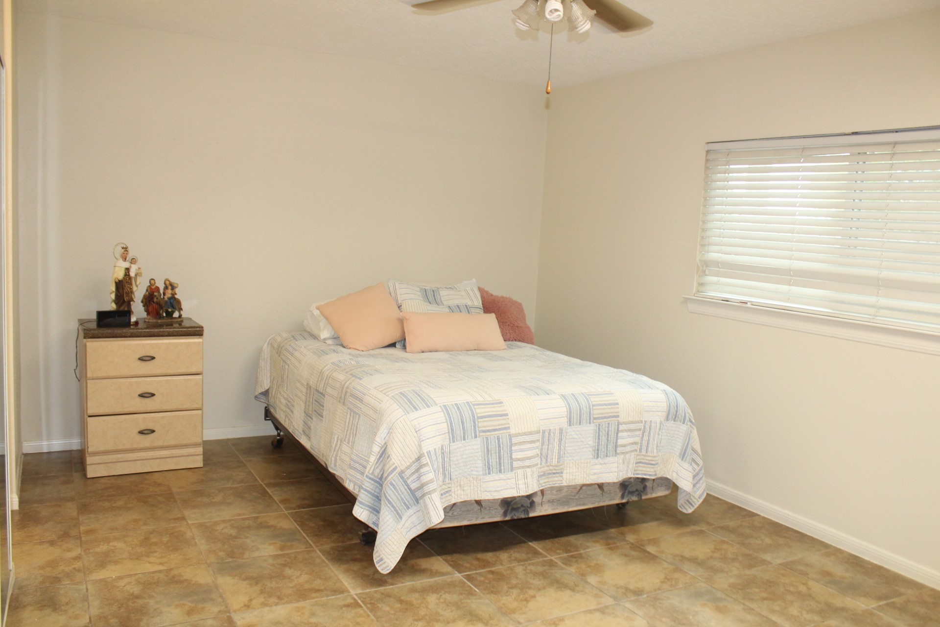 11303 Windmark Drive Houston, TX 77099 - Photo 23 of 29 a bedroom with a bed and a window