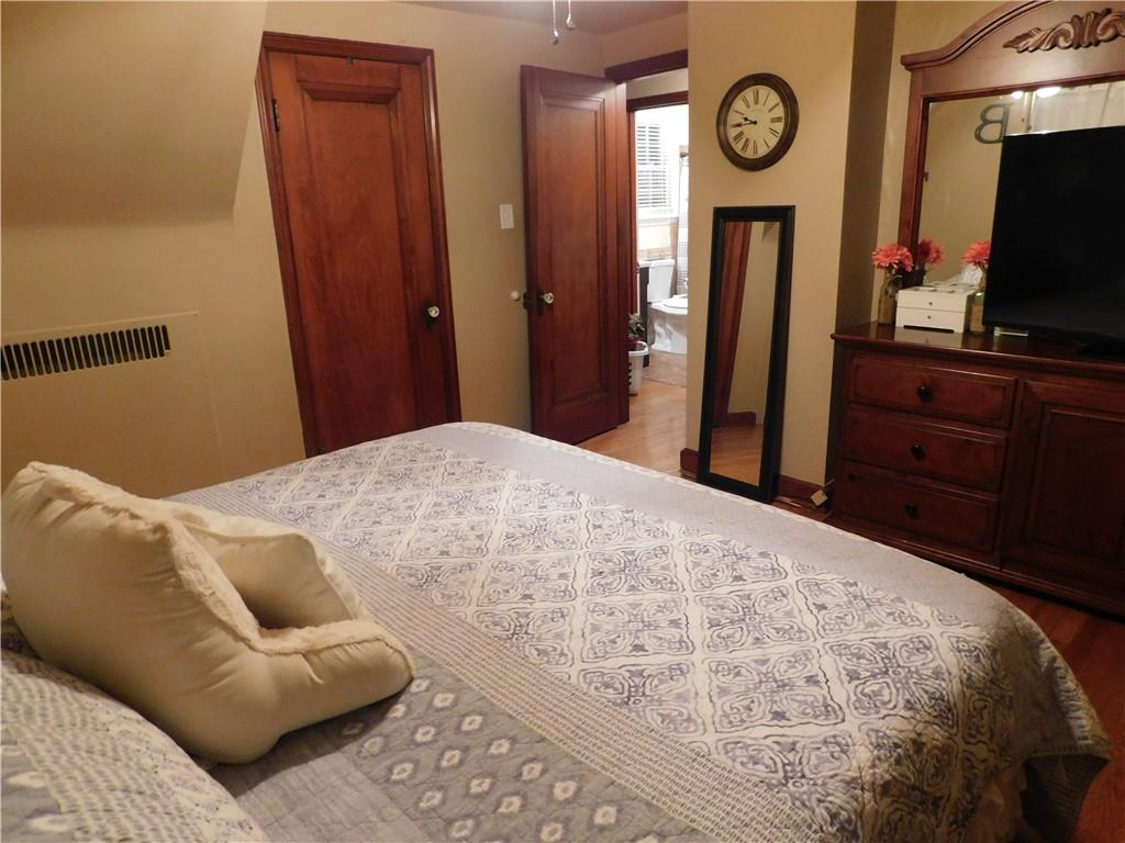 208 Springfield Avenue Washington, PA 15301 - Photo 13 of 19 a bedroom with a bed and a television in it