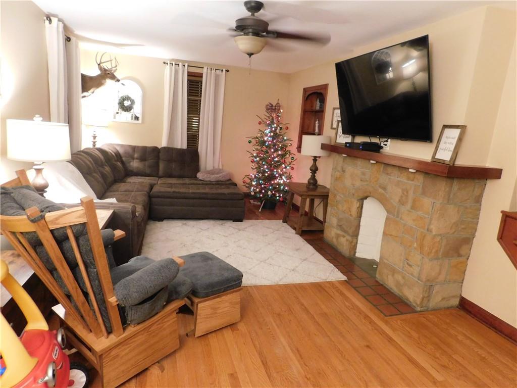 208 Springfield Avenue Washington, PA 15301 - Photo 10 of 19 a living room with furniture and a flat screen tv