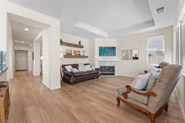 a bedroom with a bed and a wooden floor