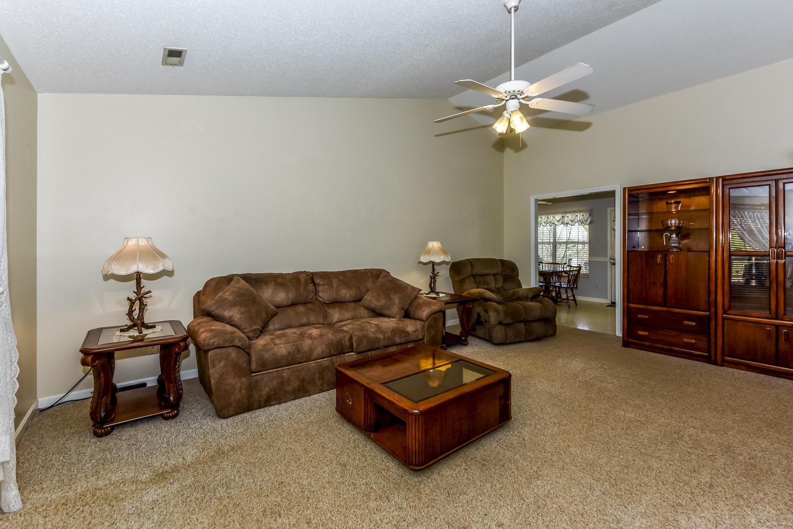 1409 Lambert Road Greenback, TN 37742 - Photo 5 of 28 a living room with furniture a ceiling fan and a rug